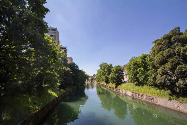 Panorama of Ljubljanica river in the city center of Ljubljana with a bridge in background in summer. it is a symbol of the capital city of Slovenia