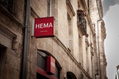 BORDEAUX, FRANCE - FEBRUARY 24, 2022: Hema Logo in front of their shop for Bordeaux. Hema is a Dutch variety store chain selling mostly accessories and toys and home goods