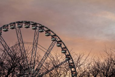 Budapest Ferris Wheel taken during a sunny evening at sunset. This big wheel is one of the landmarks of the capital city of Hungary