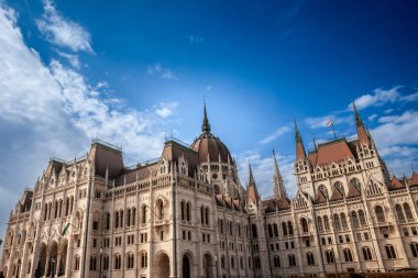 Hungarian Parliament (Orszaghaz) in Budapest, capital city of Hungary, taken during a sunny afternoon. The Parliament, of a gothic style, is an iconic landmark of the city