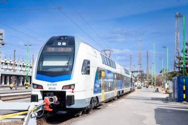 BUDAPEST, HUNGARY - FEBRUARY 26, 2022: Hungarian EMU, a Stadler Kiss, belonging to MAV Start, the passenger state hungarian railways, at Budapest Nyugati Palyaudvar train station