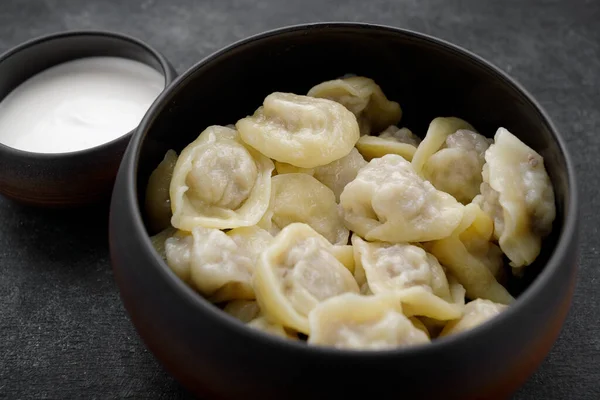 Boiled Dumplings Meat Pot Sour Cream Dark Background — Stock Photo, Image