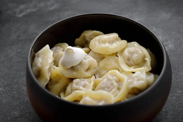 Boiled Dumplings Meat Pot Sour Cream Dark Background — Stock Photo, Image