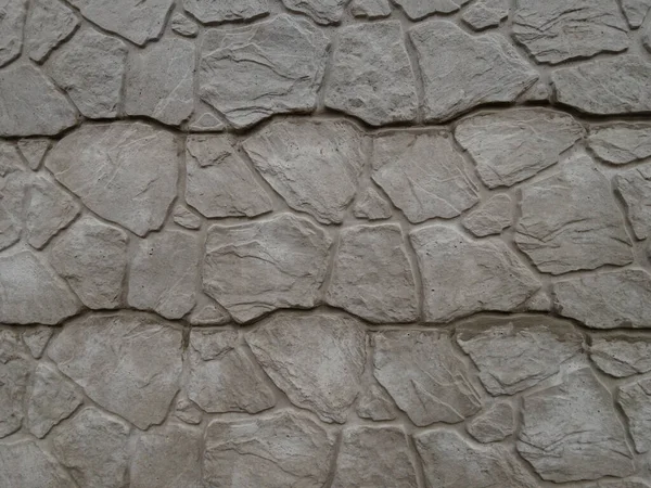 Fragment Van Een Grijze Betonnen Muur Met Een Abstract Patroon — Stockfoto