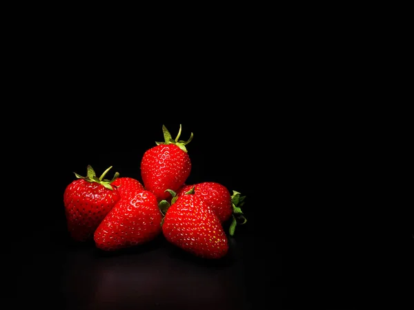 Strawberries on a black background. Isolate