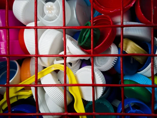 Plastic trash, bottle caps, in a special container. for collection and processing