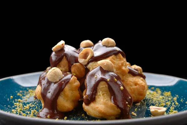 Profiteroles Dessert Nuts Plate Black Background — Stock Photo, Image