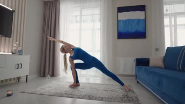 woman in sportswear doing workout burning fat calories training strength practicing effort domestic fitness females aerobics sport fit at home