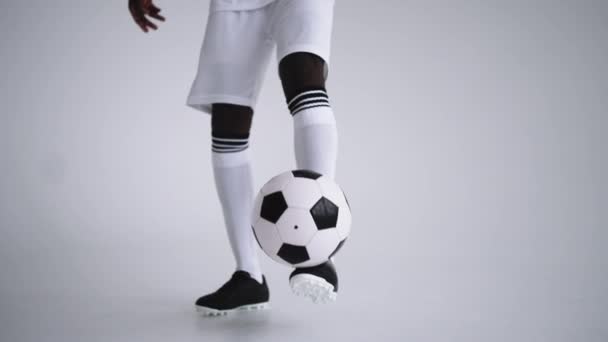 Keepie uppie by football ball, closeup of player feet kicking and holding ball, technical skill — Stock Video