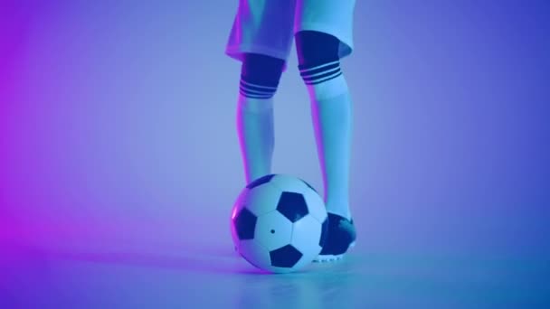Demonstrating dribbling skills in studio, closeup of feet of talented football player — Stock Video