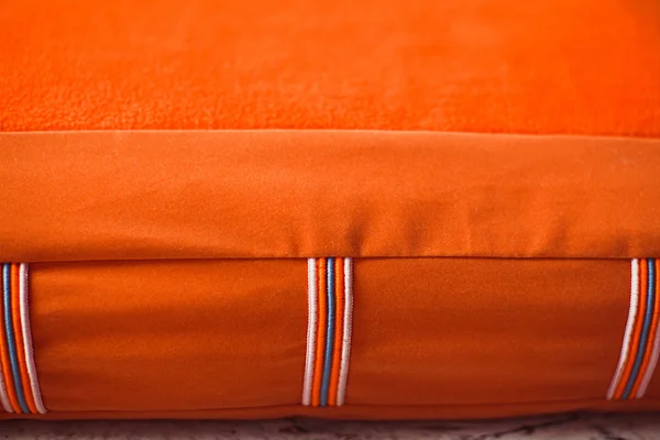 Closeup textile of orange pet mattress