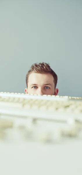 Young person and keyboards — Stock Photo, Image