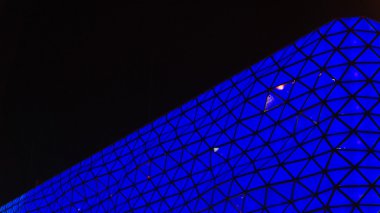 Abstract wall of mall at night
