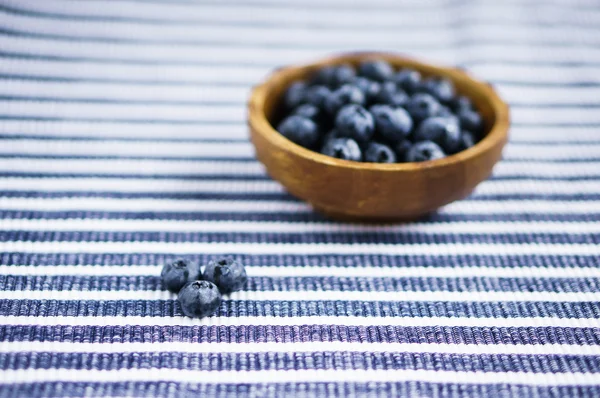 Blueberries on the wooden plate — Stock Photo, Image