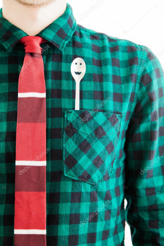 Man with tie and a spoon in the pocket