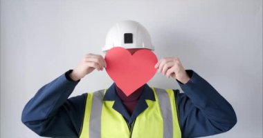 Construction worker with red heart as Valentines Day symbol