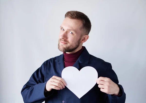 Worker showing white paper heart as Valentines Day symbol — Foto Stock