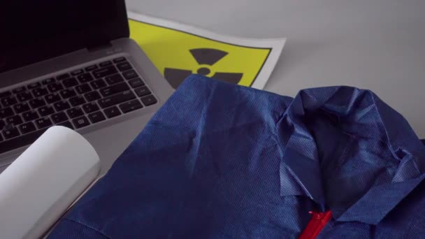 Black Gas Face Mask Rolled Blueprints Laptop Computer Engineers Table — Vídeo de Stock