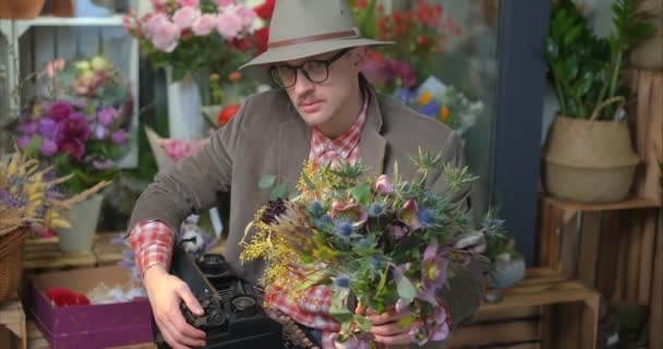 Cute Male Person Eyeglasses Hat Sitting Old Typewriter Flower Shop — Vídeos de Stock