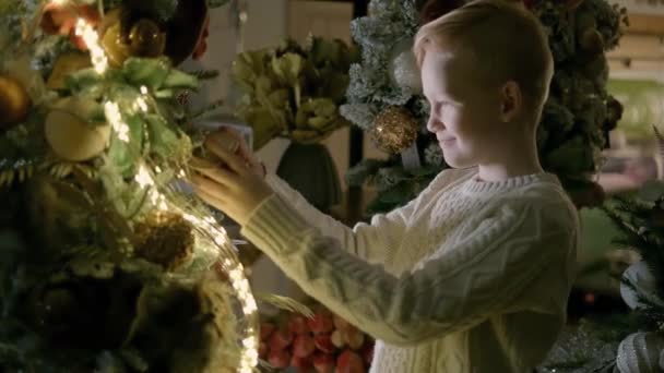 Small Kid Boy Decorating Christmas 2022 Tree Happiness Joyful Cheerful — Video Stock