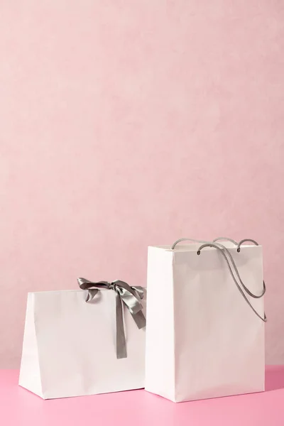 White Shopping Bags Pink Background — Stockfoto