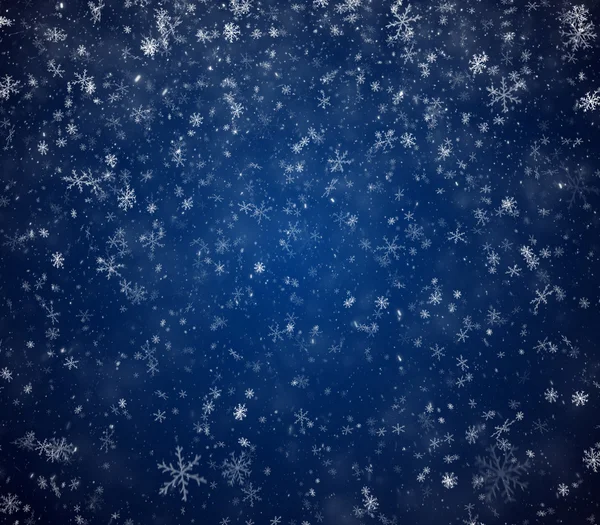 Der winterliche Hintergrund, fallende Schneeflocken — Stockfoto