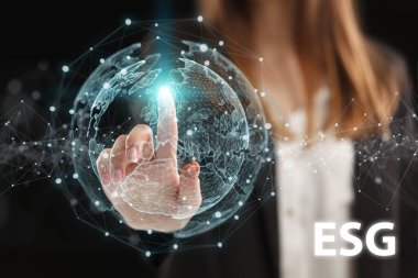 İş, Teknoloji, İnternet ve ağ konsepti. Genç işadamı geleceğin sanal ekranı üzerinde çalışıyor ve yazıyı görüyor: ESG