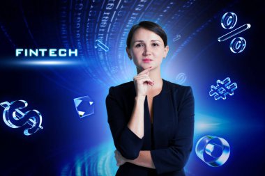 İş, Teknoloji, İnternet ve ağ konsepti. Genç işadamı geleceğin sanal ekranı üzerinde çalışıyor ve Fintech yazısını görüyor.