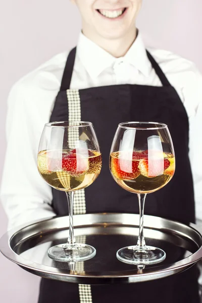 Waiter carrying a tray with champagne — Stock Photo, Image