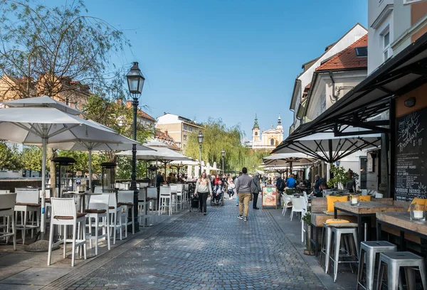 Ljubljana, Slovenia (9th October 2021) - The promenade along the river Ljubljanica with many bars and restaurants in the city center