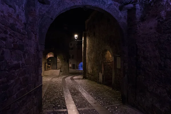 Cividale del Friuli, Italy (25th December 2021) - View of Via Monastero Maggiore, a medieval street in the historical center, under the lights of the night
