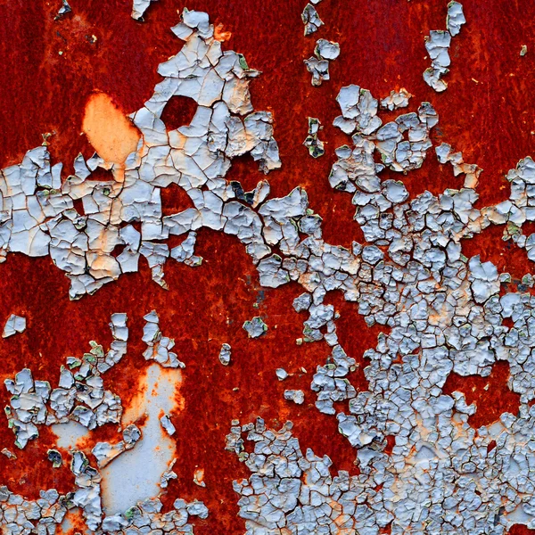 金属の背景に隠れての錆のひびの入ったペイントオールドのグランジ テクスチャ — ストック写真