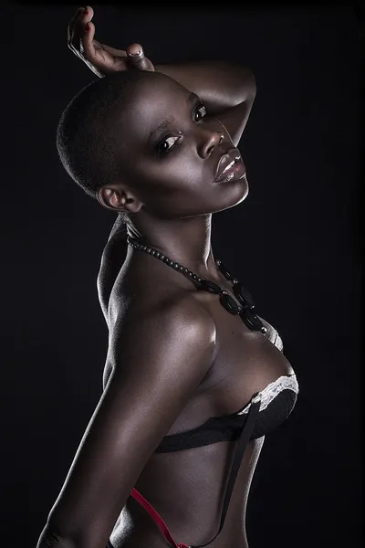 Black African young sexy fashion model studio portrait isolated — стокове фото