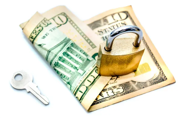 Key and padlock securing dollar note Stock Picture