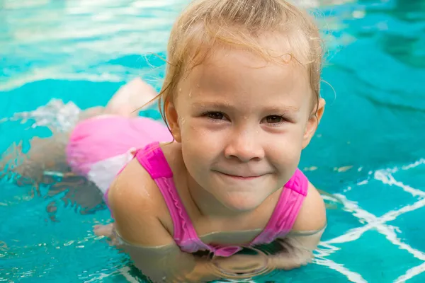 Little girl in the pool Stock Image