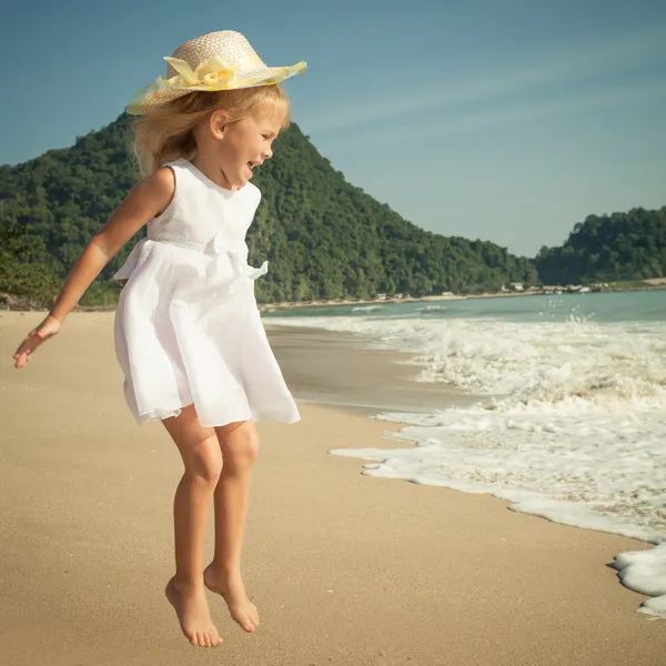 Flying jump beach girl on blue sea shore in summer vacation — Stock Photo, Image