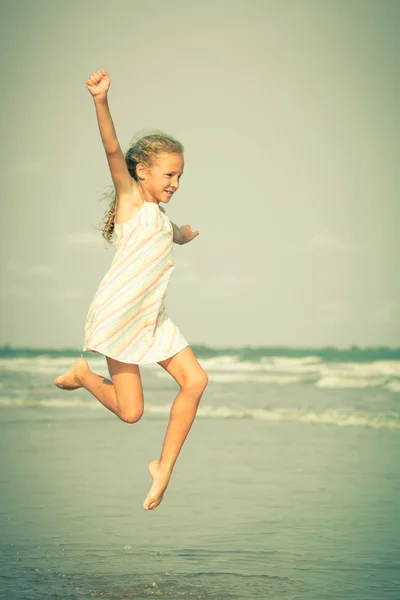 Flying jump beach girl on blue sea shore in summer vacation — Stock Photo, Image