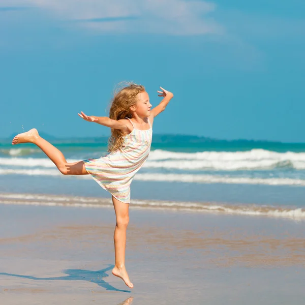 Flying jump beach girl on blue sea shore in summer vacation — Stock Photo, Image