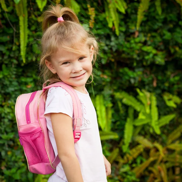 A young little girl preparing to walk to school — Stock Photo, Image