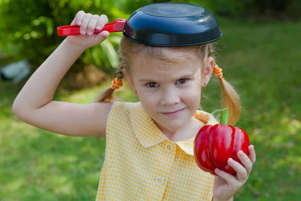 Girl holding a pan — Stock Photo, Image