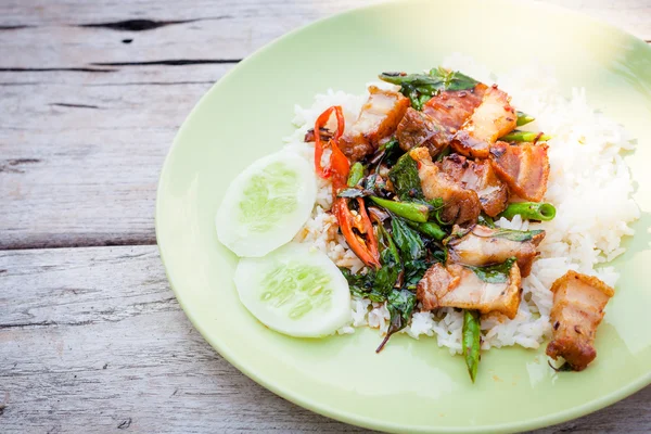 Fried crispy barbecue pork with basil leaves and chilly and egg — Stock Photo, Image