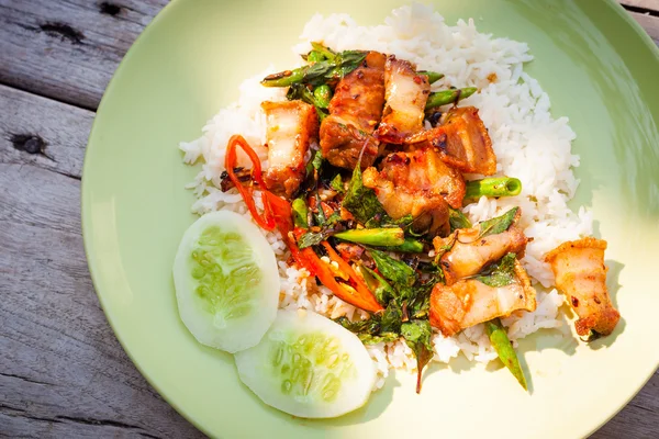 Fried crispy barbecue pork with basil leaves and chilly and egg — Stock Photo, Image