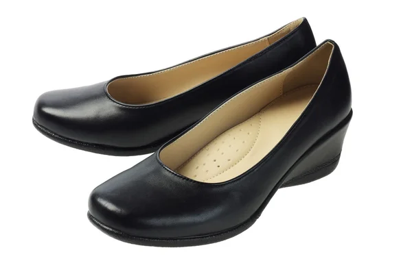 Vrouw zwarte lederen schoenen — Stockfoto