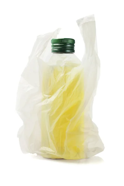 Bouteille d'huile d'olive dans un sac en plastique — Photo