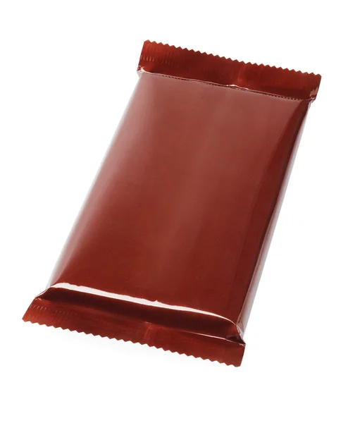 Barra de chocolate em embrulho plástico — Fotografia de Stock