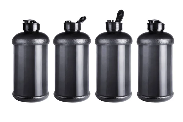 Four Black Empty Water Containers Standing Row White Background — Stock Photo, Image