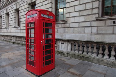 Red phone booth in London clipart
