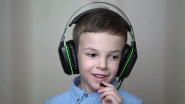 Portrait boy wear a headphone at home — стоковое видео