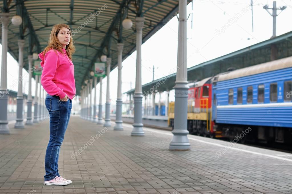 Girl on railway station platform