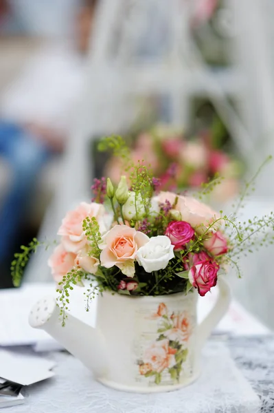 Watering can with roses — Stock Photo, Image